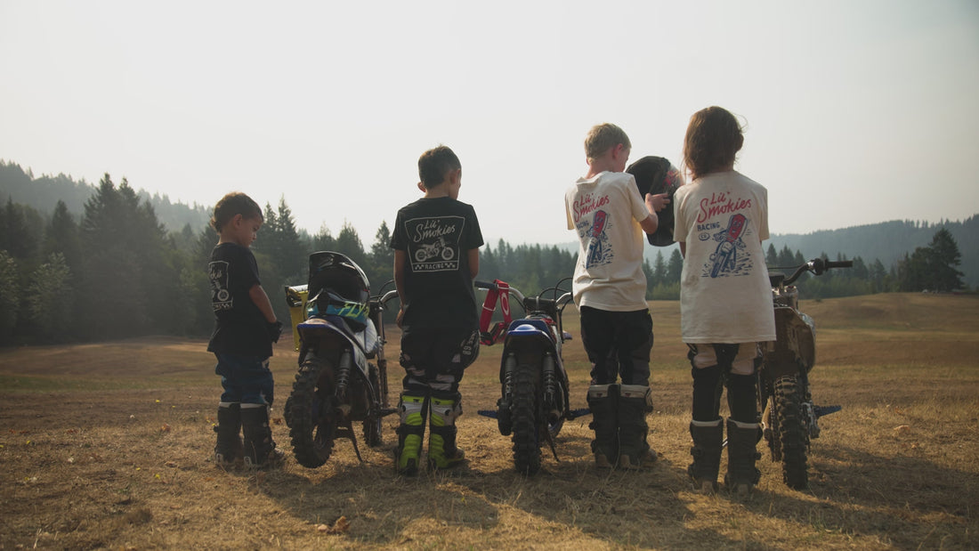 Video feature lil' smokies racing apparel. Multiple models wearing lil smokies apparel while riding motorcycles and racing dirt bikes at Washougal MX motocross track. 