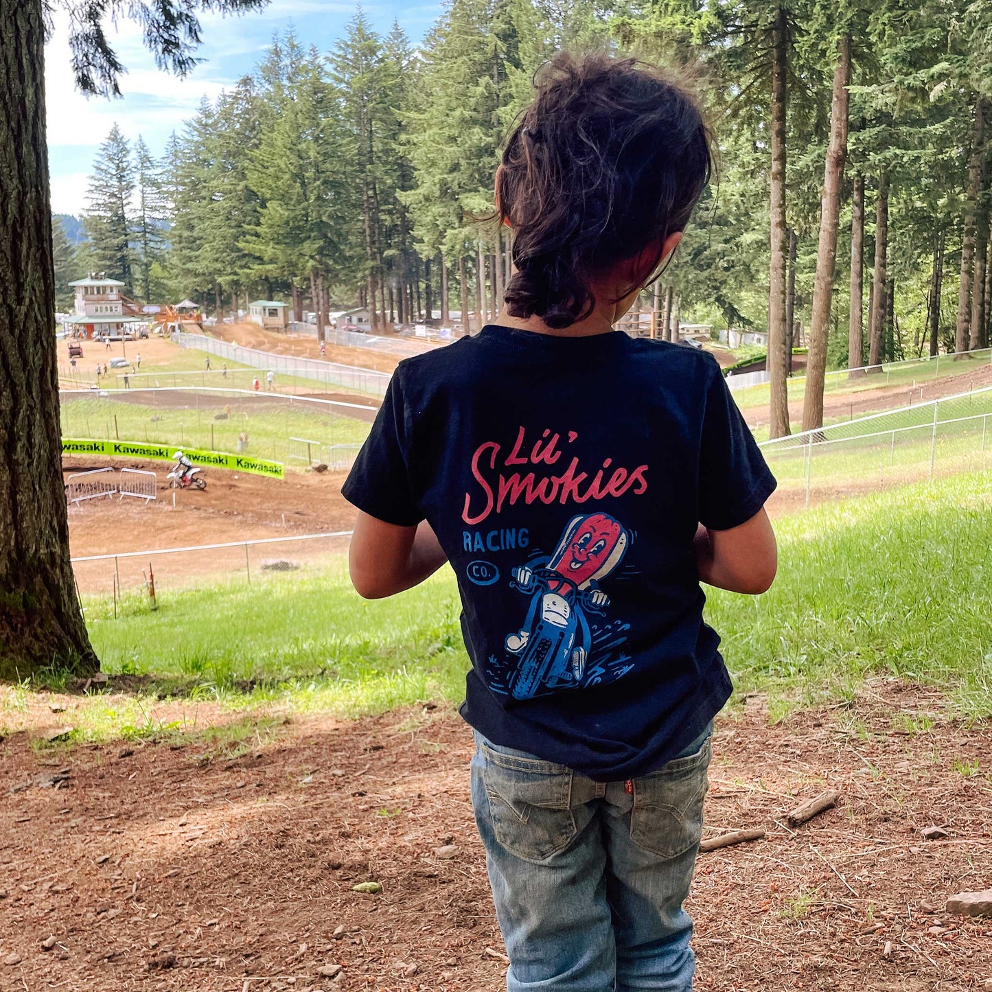 On body image of the back of the tshirt on a youth wearing a size medium.