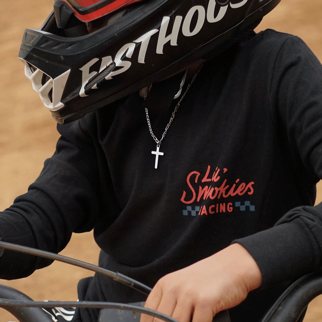 Youth motocross rider. Wearing dirtbike gear.  MX gear featuring moto apparel design.