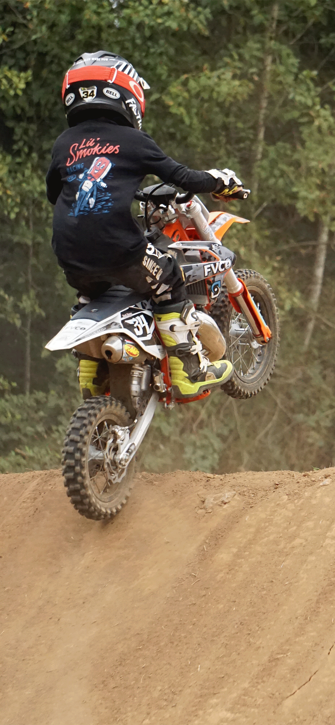 motocross rider on track. With motocross gear. MX youth apparel. 